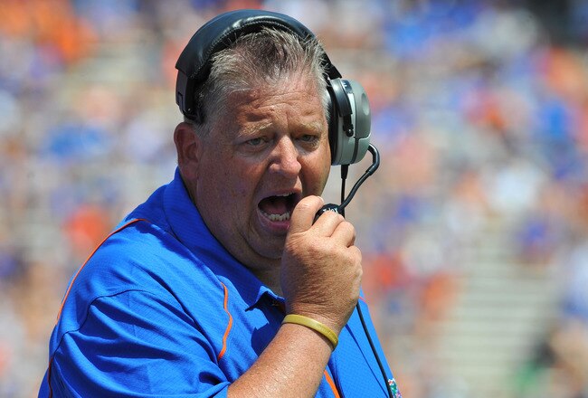 GAINESVILLE, FL - APRIL 9:  Offensive coordinator Charlie Weis of the Florida Gators directs play during the Orange and Blue spring football game April 9, 2011 at Ben Hill Griffin Stadium in Gainesville, Florida.  (Photo by Al Messerschmidt/Getty Images)