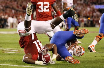Courtney Upshaw is willing to go heels over head to make a play - just ask John Brantley.
