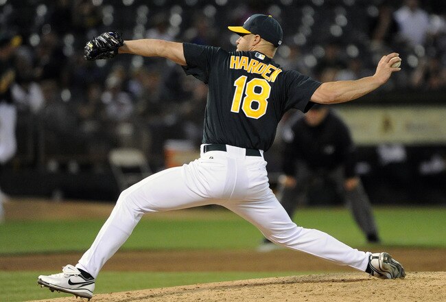 OAKLAND, CA -  JULY 1:  Rich Harden #18 of the Oakland Athletics pitches against the Arizona Diamondbacks in the six inning during a MLB baseball game July 1, 2011 at the Oakland-Alameda County Coliseum in Oakland, California. The Athletics won the game 5