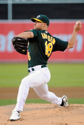 OAKLAND, CA -  JULY 1:  Rich Harden #18 of the Oakland Athletics pitches against the Arizona Diamondbacks in the first inning during a MLB baseball game July 1, 2011 at the Oakland-Alameda County Coliseum in Oakland, California. (Photo by Thearon W. Hende