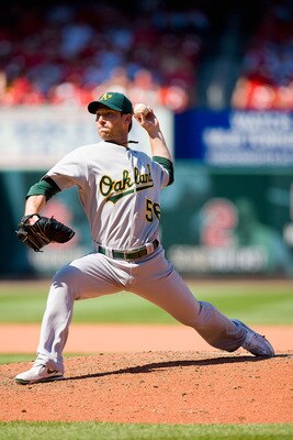 ST. LOUIS - JUNE 20: Relief pitcher Craig Breslow #56 of the Oakland Athletics bats against the St. Louis Cardinals at Busch Stadium on June 20, 2010 in St. Louis, Missouri.  (Photo by Dilip Vishwanat/Getty Images)
