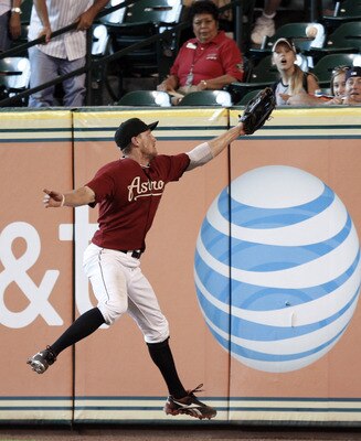 HOUSTON - JULY 17: Right fielder Hunter Pence #9 of the Houston Astros can't make a catch on a line drive hiyt by Brandon Wood of the Pittsburgh Pirates in the eleventh inning at Minute Maid Park on July 17, 2011 in Houston, Texas. (Photo by Bob Levey/Get