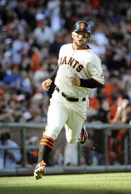 SAN FRANCISCO, CA - JUNE 26: Cody Ross #13 of the San Francisco Giants rounds third base to score on a two RBI double by Chris Stewart #37 against the Cleveland Indians in the bottom of the second inning during a MLB baseball game at AT&T Park June 26, 20