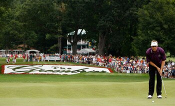 His putt for the tournament and the record.