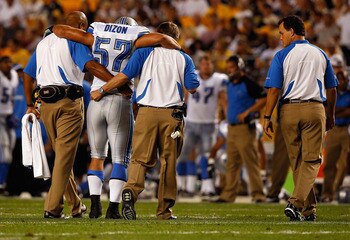PITTSBURGH - AUGUST 14:  Jordon Dizon #57 of the Detroit Lions walks off the field with the help of trainers after injuring himself during the preseason game against the Pittsburgh Steelers on August 14, 2010 at Heinz Field in Pittsburgh, Pennsylvania.  (