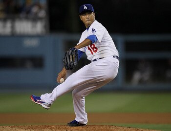 LOS ANGELES, CA - JULY 22:  Hiroki Kuroda #18 of the Los Angeles Dodgers throws a pitch against the Washington Nationals on July 22, 2011 at Dodger Stadium in Los Angeles, California.  (Photo by Stephen Dunn/Getty Images)