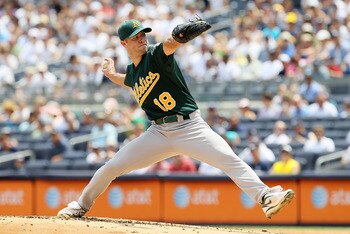 NEW YORK, NY - JULY 23:  Rich Harden #18 of the Oakland Athletics delivers a pitch against the New York Yankees on July 23, 2011 at Yankee Stadium in the Bronx borough of New York City.  (Photo by Jim McIsaac/Getty Images)