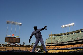 LOS ANGELES, CA - JUNE 20:   Third baseman Juan Uribe #5 of the Los Angeles Dodgers warms up before the game with the Detroit Tigers on June 20, 2011 at Dodger Stadium in Los Angeles, California.   (Photo by Stephen Dunn/Getty Images)  The Dodgers won 4-0