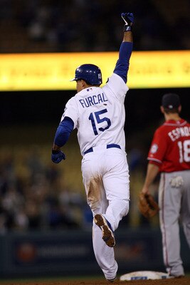 LOS ANGELES, CA - JULY 23:  Rafael Furcal #15 of the Los Angeles Dodgers celebrates his game-winning RBI double against the Washington Nationals in the ninth inning of the game at Dodger Stadium on July 23, 2011 in Los Angeles, California.  The Dodgers de