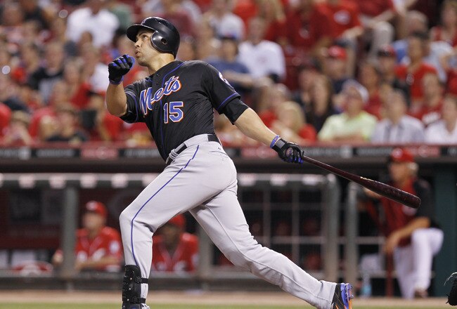 CINCINNATI, OH - JULY 25: Carlos Beltran #15 of the New York Mets drives in the game-tying run in the seventh inning with a sacrifice fly against the Cincinnati Reds at Great American Ball Park on July 25, 2011 in Cincinnati, Ohio. (Photo by Joe Robbins/G