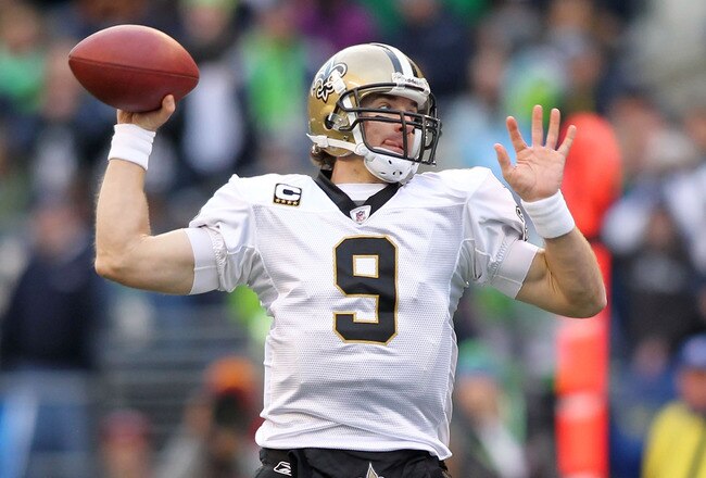 SEATTLE, WA - JANUARY 08:  Quarterback Drew Brees #9 of the New Orleans Saints throws the ball against the Seattle Seahawks during the 2011 NFC wild-card playoff game at Qwest Field on January 8, 2011 in Seattle, Washington.  (Photo by Jonathan Ferrey/Get