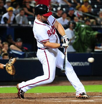 ATLANTA - JULY 25: Dan Uggla #26 of the Atlanta Braves hits against the Pittsburgh Pirates at Turner Field on July 25, 2011 in Atlanta, Georgia. (Photo by Scott Cunningham/Getty Images)