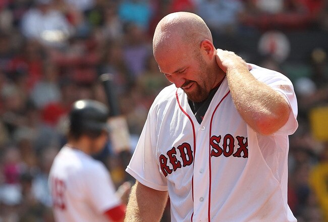 BOSTON, MA  - JULY 4:  Kevin Youkilis #20 of the Boston Red Sox leaves the game after being hit by a pitch against the Toronto Blue Jays at Fenway Park on July 4, 2011 in Boston, Massachusetts.  (Photo by Jim Rogash/Getty Images)