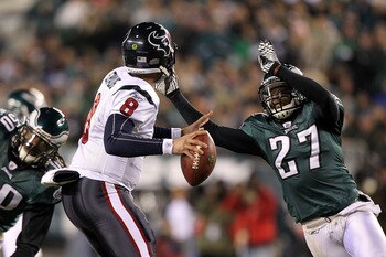 PHILADELPHIA, PA - DECEMBER 02:  Quintin Mikell #27 of the Philadelphia Eagles applies pressure on a blitz against quarterback Matt Schaub #8 of the Houston Texans at Lincoln Financial Field on December 2, 2010 in Philadelphia, Pennsylvania.  (Photo by Al