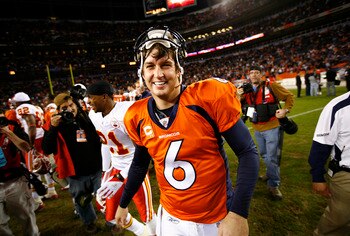 DENVER - DECEMBER 7: Quarterback Jay Cutler #6 of the Denver Broncos flashes a big smile as he shakes hands after beating the Kansas City Chiefs in week 14 NFL action at Invesco Field at Mile High on December 7, 2008 in Denver, Colorado. Denver beat Kansa