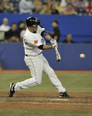 TORONTO, CANADA - JULY 26:  John McDonald #6 of the Toronto Blue Jays bats during MLB game action against the Baltimore Orioles July 26, 2011 at Rogers Centre in Toronto, Ontario, Canada. (Photo by Brad White/Getty Images)