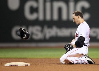 BOSTON, MA - JULY 26:  Marco Scutaro #10 of the Boston Red Sox reacts after he was out at second base to end the 12th inning against the Kansas City Royals on July 26, 2011 at Fenway Park in Boston, Massachusetts.  (Photo by Elsa/Getty Images)
