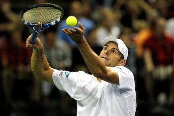 AUSTIN, TX - JULY 08: Andy Roddick serves to David Ferrer of Spain in their tie during the Davis Cup between USA and Spain at the Frank Erwin Center on July 8, 2011 in Austin, Texas.  (Photo by Matthew Stockman/Getty Images)