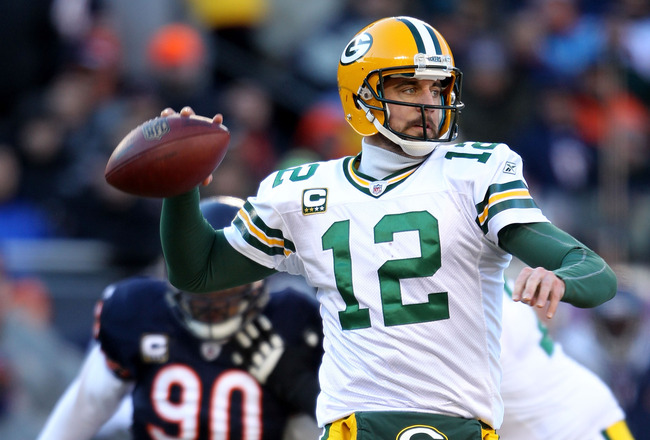 CHICAGO, IL - JANUARY 23:  Quarterback Aaron Rodgers #12 of the Green Bay Packers looks to pass against the Chicago Bears in the NFC Championship Game at Soldier Field on January 23, 2011 in Chicago, Illinois.  (Photo by Andy Lyons/Getty Images)