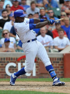 CHICAGO, IL - JULY 24: Alfonso Soriano #12 of the Chicago Cubs breaks his bat and hits an RBI single in the eighth inning against the  Houston Astros on July 24, 2011 at Wrigley Field in Chicago, Illinois. The Cubs defeated the Astros 5-4 in ten innings.