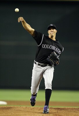 PHOENIX, AZ - JULY 24:  Starting pitcher Ubaldo Jimenez #38 of the Colorado Rockies pitches against the Arizona Diamondbacks during the Major League Baseball game at Chase Field on July 24, 2011 in Phoenix, Arizona.  The Diamondbacks defeated the Rockies