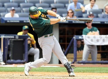 NEW YORK, NY - JULY 23:  Josh Willingham #16 of the Oakland Athletics hits a third inning two run home run against the New York Yankees on July 23, 2011 at Yankee Stadium in the Bronx borough of New York City.  (Photo by Jim McIsaac/Getty Images)