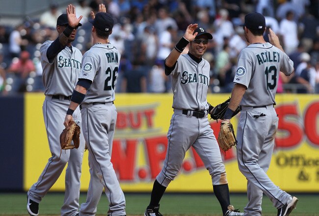 NEW YORK, NY - JULY 27: The Seattle Mariners celebrate the win against the New York Yankees on July 27, 2011 at Yankee Stadium in the Bronx borough of New York City.  (Photo by Nick Laham/Getty Images)