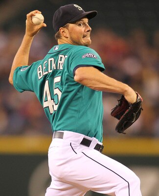 SEATTLE - JUNE 27:  Starting pitcher Erik Bedard #45 of the Seattle Mariners pitches against the Atlanta Braves at Safeco Field on June 27, 2011 in Seattle, Washington. (Photo by Otto Greule Jr/Getty Images)