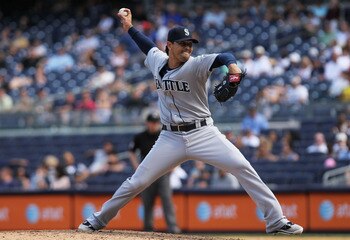 NEW YORK, NY - JULY 27: Brandon League #43 of the Seattle Mariners pitches against the New York Yankees on July 27, 2011 at Yankee Stadium in the Bronx borough of New York City.  (Photo by Nick Laham/Getty Images)