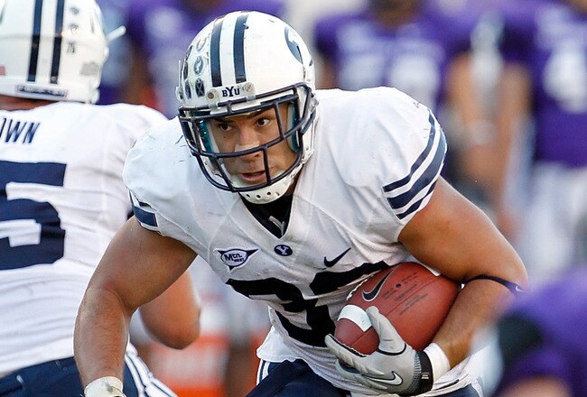 FORT WORTH, TX - OCTOBER 16:  Running back Bryan Kariya #33 of the BYU Cougars carries the ball against the TCU Horned Frogs at Amon G. Carter Stadium on October 16, 2010 in Fort Worth, Texas. TCU beat BYU 31-3.  (Photo by Tom Pennington/Getty Images)