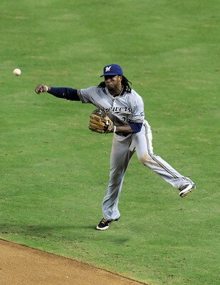 PHOENIX, AZ - JULY 19:  Rickie Weeks #23 of the Milwaukee Brewers throws the ball to first base after making a play against the Arizona Diamondbacks at Chase Field on July 19, 2011 in Phoenix, Arizona.  The Brewers defeated the Diamondbacks 11-3. (Photo b