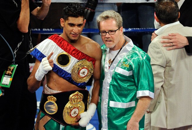 LAS VEGAS, NV - JULY 23:  Amir Khan and trainer Freddie Roach pose after Khan's fifth round knockout of Zab Judah in their super lightweight world championship unification bout at Mandalay Bay Events Center on July 23, 2011 in Las Vegas, Nevada.  (Photo b