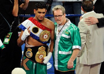 LAS VEGAS, NV - JULY 23:  Amir Khan and trainer Freddie Roach pose after Khan's fifth round knockout of Zab Judah in their super lightweight world championship unification bout at Mandalay Bay Events Center on July 23, 2011 in Las Vegas, Nevada.  (Photo b