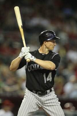 PHOENIX, AZ - JULY 22:  Mark Ellis #14 of the Colorado Rockies bats against the Arizona Diamondbacks during the Major League Baseball game at Chase Field on July 22, 2011 in Phoenix, Arizona. The Rockies defeated the Diamondbacks 8-4.  (Photo by Christian