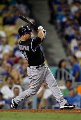 LOS ANGELES, CA - JULY 27:  Ty Wigginton #21 of the Colorado Rockies hits an RBI double against the Los Angeles Dodgers in the seventh inning at Dodger Stadium on July 27, 2011 in Los Angeles, California.  (Photo by Jeff Gross/Getty Images)