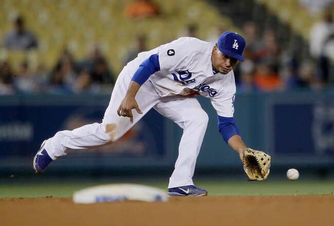 LOS ANGELES, CA - JULY 27:  Shortstop Rafael Furcal #15 of the Los Angeles Dodgers can't make the play on a ball hit by Troy Tulowitzki (not pictured) of the Colorado Rockies in the ninth inning at Dodger Stadium on July 27, 2011 in Los Angeles, Californi