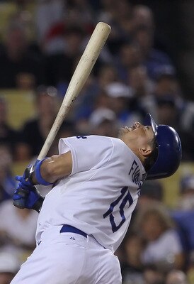 LOS ANGELES, CA - JULY 26:  Rafael Furcal #15 of the Los Angeles Dodgers winces after being hit by a pitch in the fifth inning against the Colorado Rockies at Dodger Stadium on July 26, 2011 in Los Angeles, California. The Dodgers defeated the Rockies 3-2