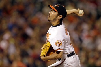 BALTIMORE, MD - JULY 16: Pitcher Koji Uehara #19 of the Baltimore Orioles delivers to a Cleveland Indians batter at Oriole Park at Camden Yards on July 16, 2011 in Baltimore, Maryland.  (Photo by Rob Carr/Getty Images)