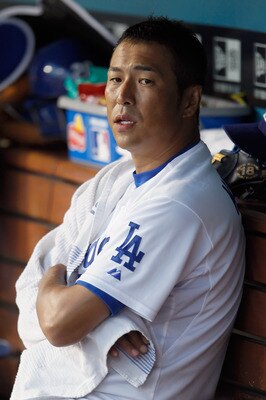 LOS ANGELES, CA - JULY 27:  Hiroki Kuroda #18 of the Los Angeles Dodgers looks on from the dugout during the second inning against the Colorado Rockies at Dodger Stadium on July 27, 2011 in Los Angeles, California. The Rockies defeated the Dodgers 3-1. (P