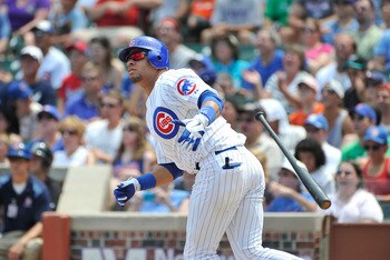 CHICAGO, IL - JULY 17:  Aramis Ramirez #16 of the Chicago Cubs hits an RBI double scoring Starlin Castro during the first inning against the Florida Marlins at Wrigley Field on July 17, 2011 in Chicago, Illinois.  (Photo by Brian Kersey/Getty Images)