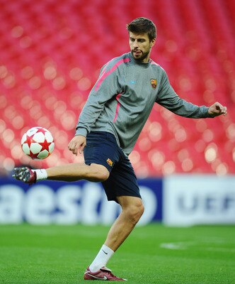 LONDON, ENGLAND - MAY 27:  Gerard Pique of FC Barcelona controls the ball during a Barcelona training session prior to the UEFA Champions League final versus Manchester United at Wembley Stadium on May 27, 2011 in London, England.  (Photo by Clive Mason/G