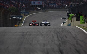 SAO PAULO, BRAZIL - NOVEMBER 07: Lewis Hamilton of Great Britain and McLaren Mercedes (L) and Nico Huelkenberg of Germany and Williams compete during the Brazilian Formula One Grand Prix at the Interlagos Circuit on November 7, 2010 in Sao Paulo, Brazil.