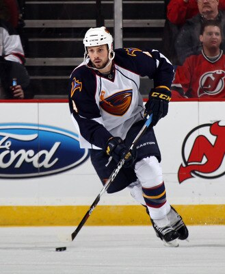 NEWARK, NJ - MARCH 15: Zach Bogosian #4 of the Atlanta Thrashers skates against the New Jersey Devils at the Prudential Center on March 15, 2011 in Newark, New Jersey. The Devils defeated the Thrashers 4-2.  (Photo by Bruce Bennett/Getty Images)