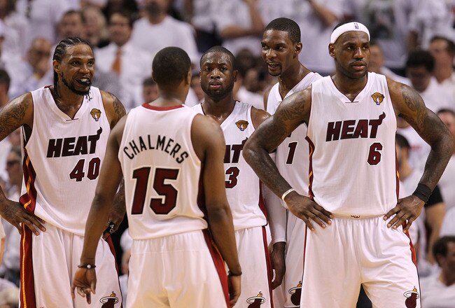MIAMI, FL - MAY 31:  (R) LeBron James #6 of the Miami Heat reacts with teammates Mario Chalmers #15, Dwyane Wade #3, Chris Bosh #1 and Udonis Haslem #40 in the fourth quarter while taking on the Dallas Mavericks in Game One of the 2011 NBA Finals at Ameri