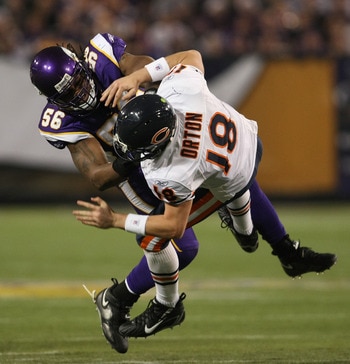 MINNEAPOLIS - DECEMBER 17: E.J. Henderson #56 of the Minnesota Vikings hits Kyle Orton #18 of the Chicago Bears after a pass at the Hubert H. Humphrey Metrodome on December 17, 2007 in Minneapolis, Minnesota. (Photo by Jonathan Daniel/Getty Images)