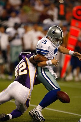 MINNEAPOLIS, MN - SEPTEMBER 4: Quarterback Jon Kitna #3 of the Dallas Cowboys fumbles the football as he is hit by defensive end Jayme Mitchell #92 of the Minnesota Vikings at Hubert H. Humphrey Metrodome on September 4, 2009 in Minneapolis, Minnesota. (P