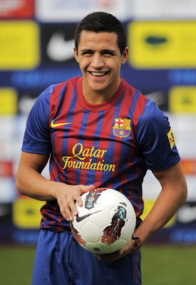 BARCELONA, SPAIN - JULY 25: Alexis Sanchez from Chile poses during his presentation as the new signing for FC Barcelona at the Joan Gamper training camp sports complex on July 25, 2011 in Barcelona, Spain. (Photo by David Ramos/Getty Images)