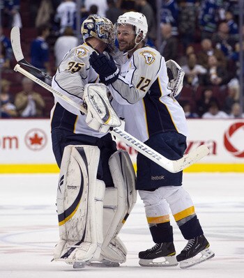 VANCOUVER, CANADA - APRIL 30: Goalie Pekka Rinne #35 of the Nashville Predators is congratulated by Mike Fisher #12 after defeating the Nashville Predators 2-1 in the second overtime period in Game Two of the Western Conference Semifinals during the 2011 
