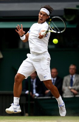 LONDON, ENGLAND - JULY 03:  Rafael Nadal of Spain returns a shot during his final round Gentlemen's match against Novak Djokovic of Serbia on Day Thirteen of the Wimbledon Lawn Tennis Championships at the All England Lawn Tennis and Croquet Club on July 3