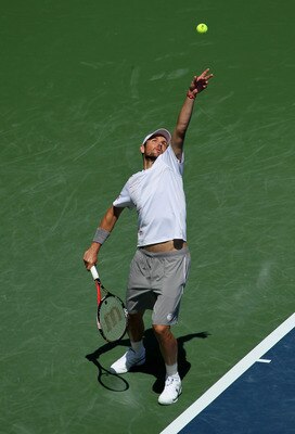 LOS ANGELES, CA - JULY 30:  Mardy Fish serves to Ryan Harrison in the semifinals during Day 6 of the Farmers Classic presented by Mercedes-Benz at the LA Tennis Center on July 30, 2011 in Los Angeles, California. Fish won 6-0, 4-6, 7-6 (3).  (Photo by Ste